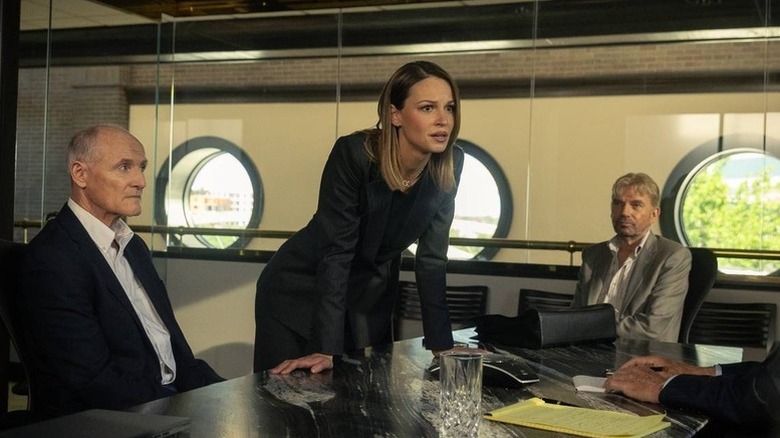 Rebecca Falcone leaning on a table on "Landman"