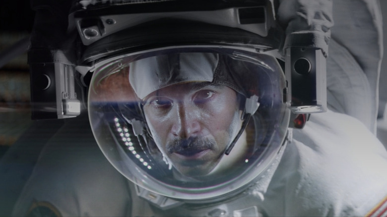 Chris Messina's Gordon Barrett looks out of his space suit in closeup in I.S.S.