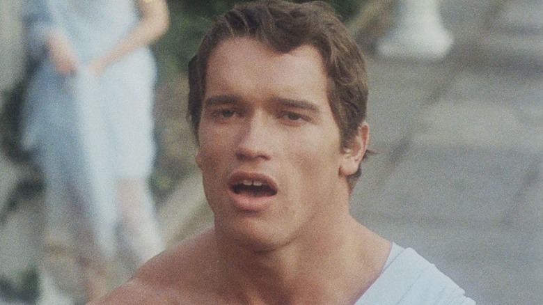 Arnold Schwarzenegger's Hercules stands on steps talking in Hercules in New York