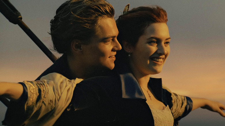 Jack and Rose stand together on the bow of the Titanic