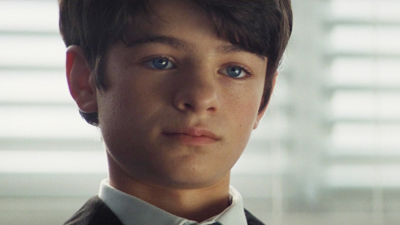 Ferdia Shaw as Artemis II putting on a poker face in Artemis Fowl