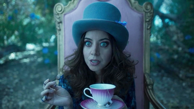 Aubrey Plaza as the Shadow King dressed like the Mad Hatter from Alice in Wonderland in Legion