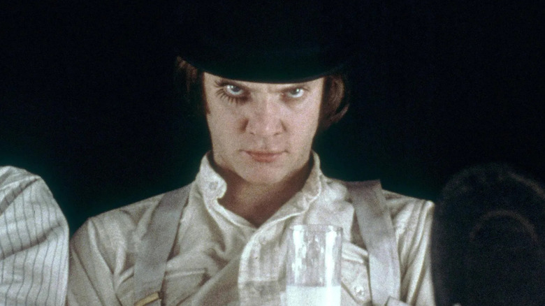 Alex DeLarge (Malcolm McDowell) holding a glass of milk in A Clockwork Orange