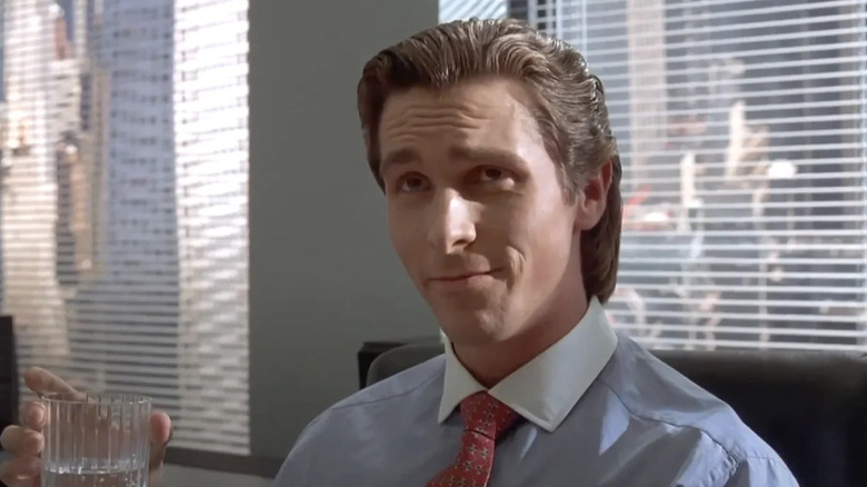 Patrick Bateman (Christian Bale) smirking in American Psycho