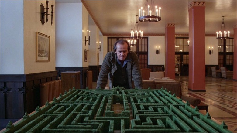 Jack Torrance (Jack Nicholson) looking at hedge maze model in The Shining