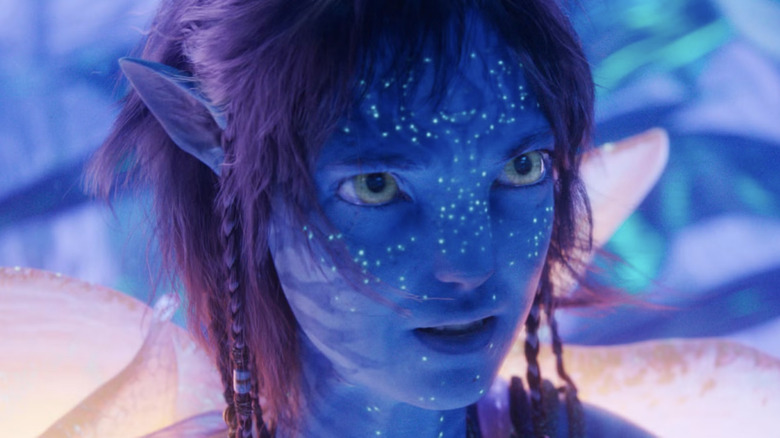 Kiri underwater with glowing wings in Avatar: Fire and Ash