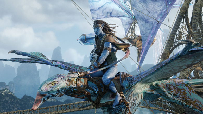 Jake Sully flying in his ikran alongside the windtraders in Avatar: Fire and Ash