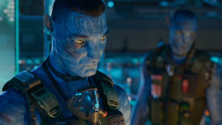 Stephen Lang as Colonel Quaritch standing in a lab with another soldier in Avatar: Fire & Ash