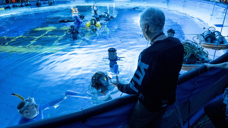 James Cameron directing the cast of Avatar: The Way of Water in a massive water tank