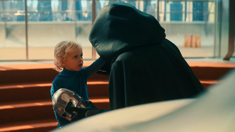 Doctor Doom looking at Franklin Richards in The Fantastic Four: First Steps