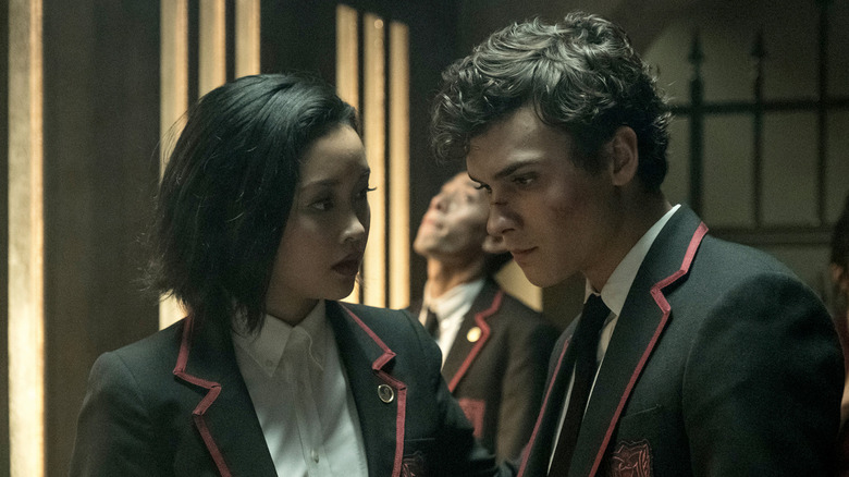 Benjamin Wadsworth and Lana Condor as Marcus and Saya, talking in the hall in Deadly Class