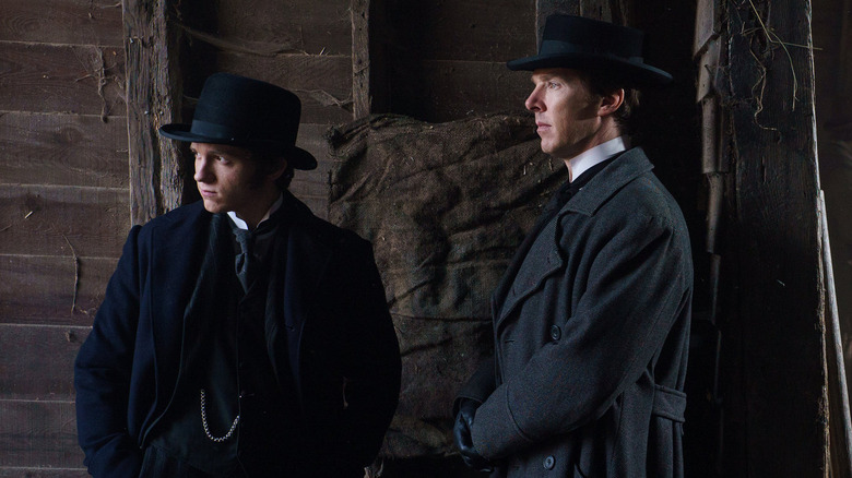 Tom Holland as Samuel Insull standing next to Benedict Cumberbatch as Thomas Edison in The Current War