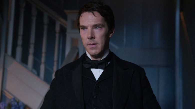 Benedict Cumberbatch as Thomas Edison standing in front of a staircase in The Current War