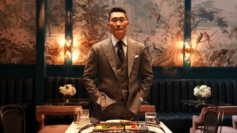 Daniel Dae Kim as Daniel Jung standing at the dinner table in the Premise episode Butt Plug