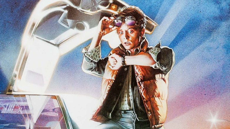 Marty McFly looking at his watch standing by the DeLorean on the poster for Back to the Future