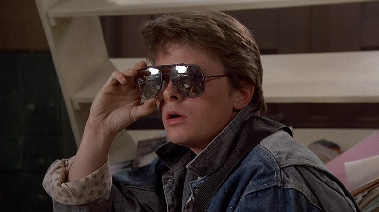 Michael J. Fox as Marty removing his sunglasses in Back to the Future