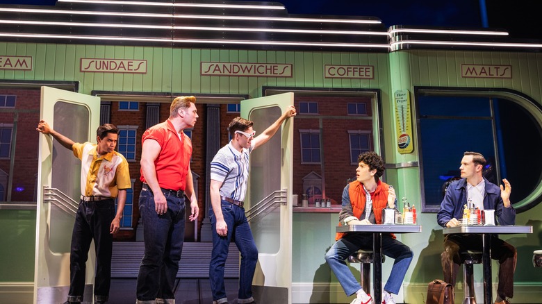 Biff (Nathaniel Hackmann) confronting Marty (Casey Likes) and George McFly (Hugh Coles) in Back to the Future: The Musical
