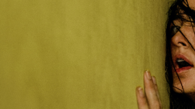 Backrooms poster featuring a frightened Renate Reinsve