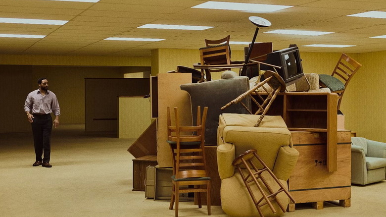 Clark comes upon a mountain of chairs in Backrooms