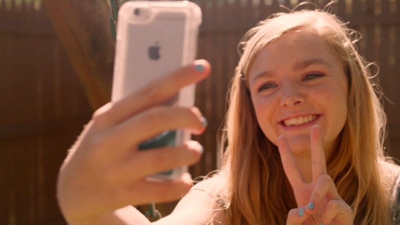 Kayla talking a selfie in Eighth Grade