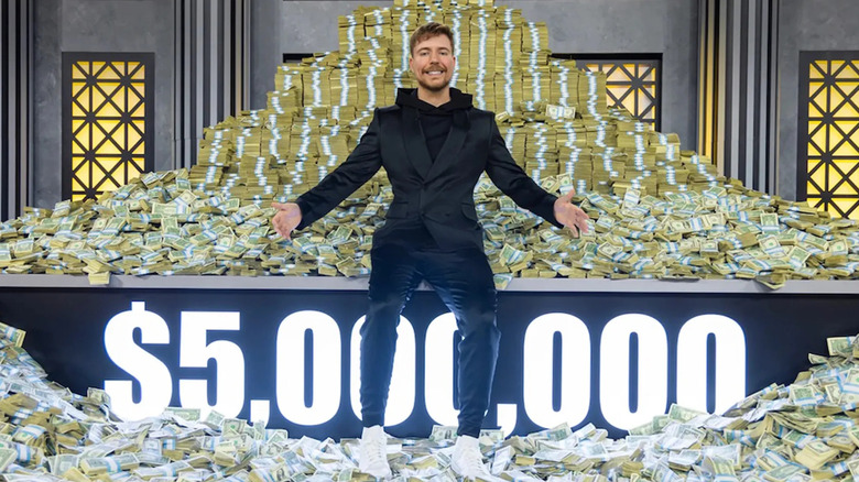 MrBeast standing in front of prize money for Beast Games