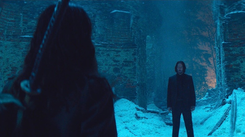 Keanu Reeves as John Wick getting ready to square off with Ana de Armas as Eve in Ballerina