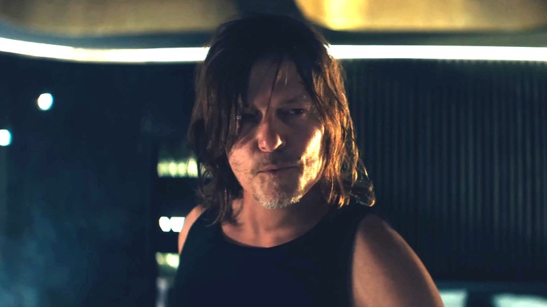 Norman Reedus as Daniel in his hotel room speaking with Eve in From the World of John Wick: Ballerina