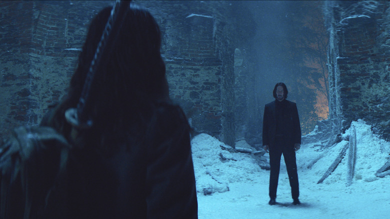 Eve faces John Wake in snow in a ballet dancer