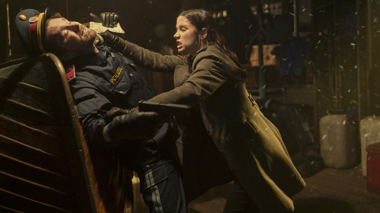 Ana de Armas as Eve Macarro stabbing a combatant in the neck in Ballerina