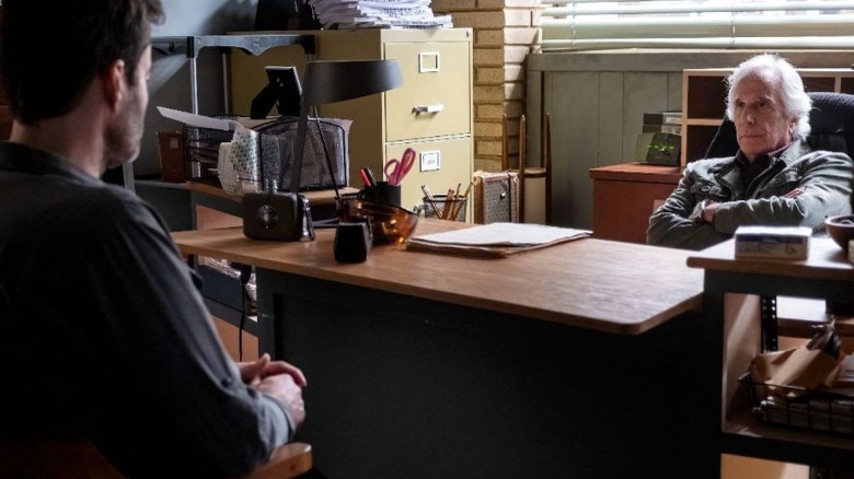 Barry and Gene across desk