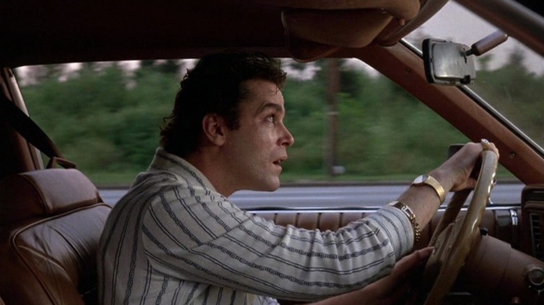 Ray Liotta as Henry Hill driving car and looking up at sky while sweating in Goodfellas