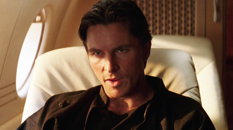 Christian Bale's Bruce Wayne sits on his private jet in Batman Begins