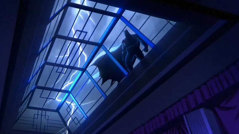 Batman is seen through a skylight silhouetted against a stormy sky in Creature Commandos