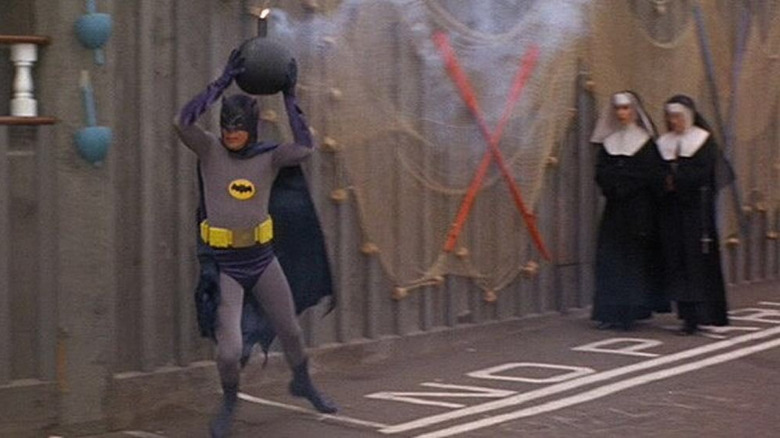 Batman running around with a bomb