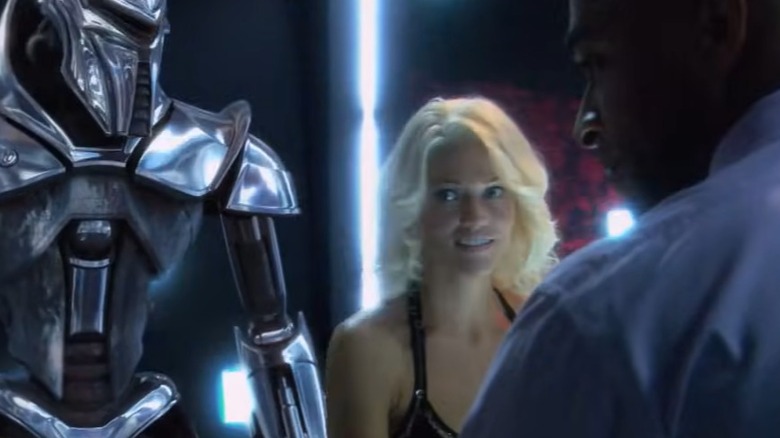 Battlestar Galactica The Plan - Six and Cylon Centurion in background