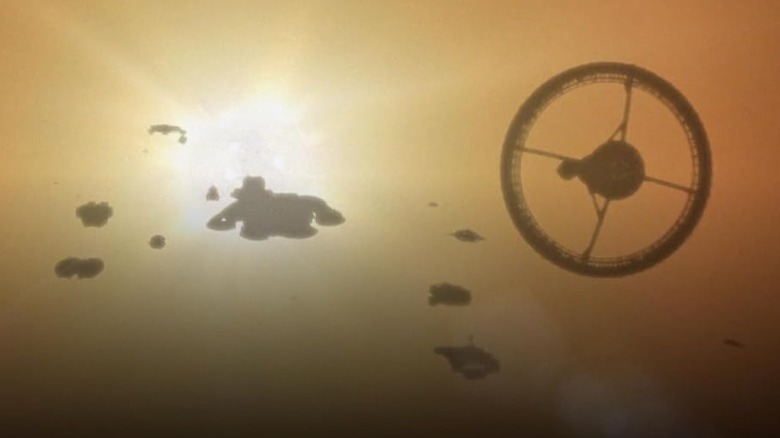 Battlestar Galactica Daybreak - Galactica and the fleet flying into the sun