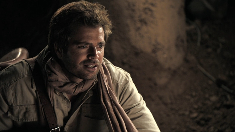 Doug Adler (David Charvet) in cave in Prisoners of the Sun