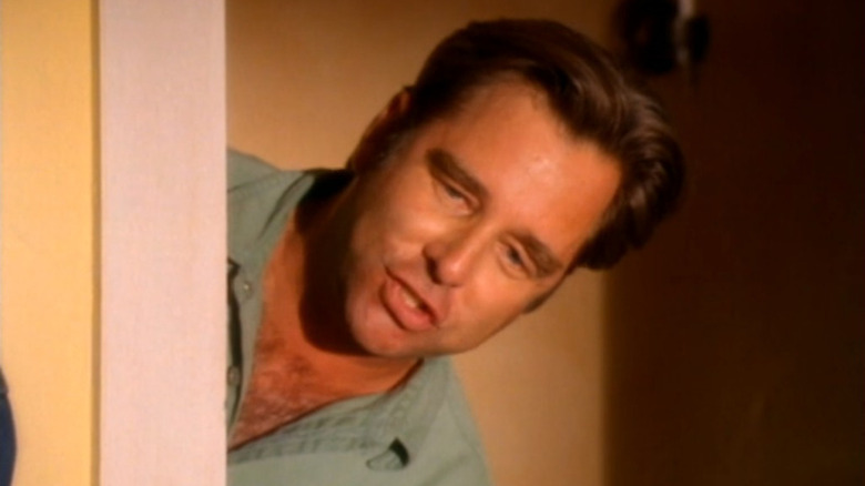 Dave Hart poking his head around a doorway in Harts of the West