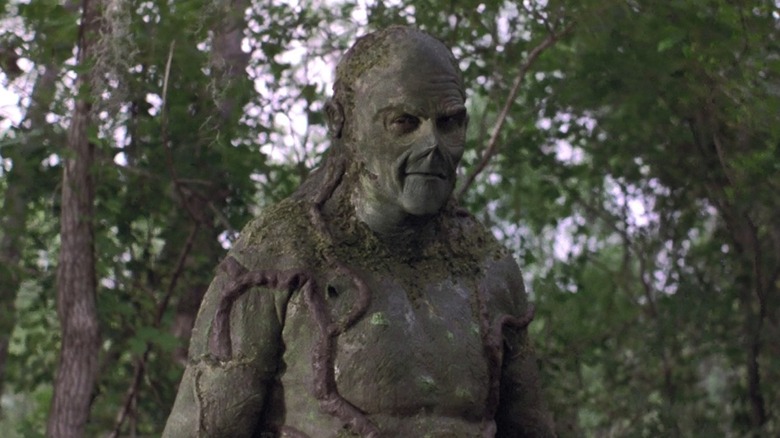 Dick Durock as Swamp Thing walking in the woods in Swamp Thing (1982)