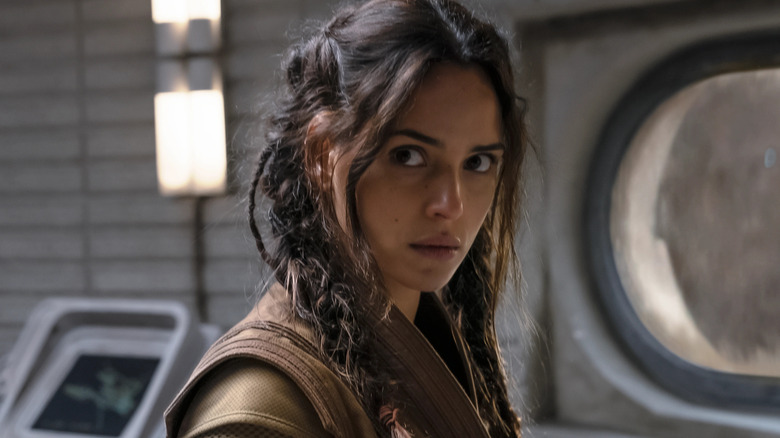 Adria Arjona's Bix Caleen looks out over a control panel in Andor