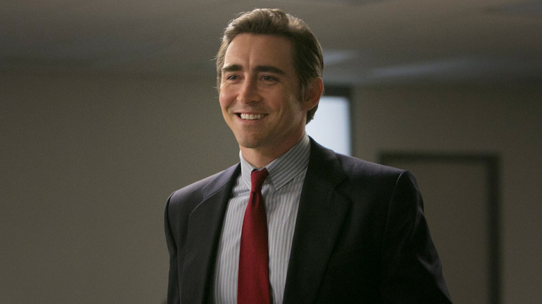 Lee Pace as Joe MacMillan smiling in a suit in Halt and Catch Fire