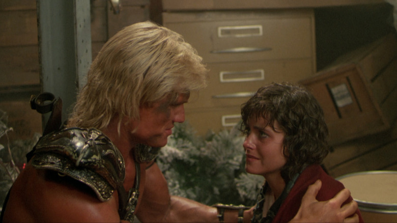 Dolph Lundgren as He-Man Courteney Cox as Julie Winston in Masters of the Universe