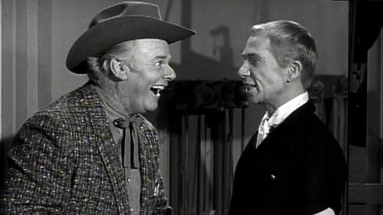 Alan Hale Jr.'s Omar M. Keck smiles as he stands opposite Ray Walston's Uncle Martin O'Hara in My Favorite Martian