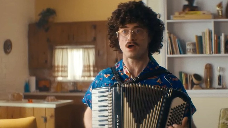 Daniel Radcliffe in the role of Yangovic comes out on the accordion in Gharib: the story of the yankovic