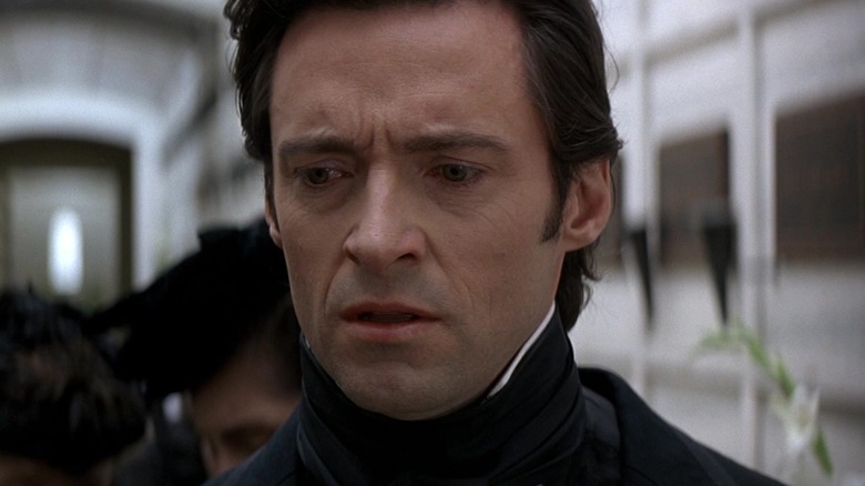 Hugh Jackman as Robert Angier looking distraught in The Prestige