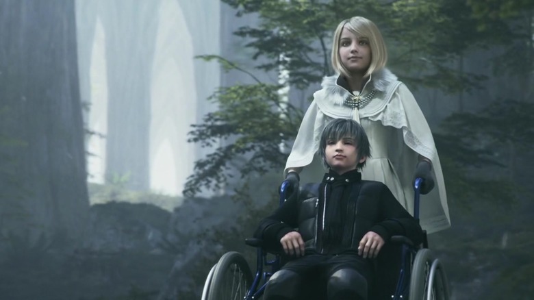 A child in a wheelchair being pushed by a girl in white in Kingsglaive: Final Fantasy XV