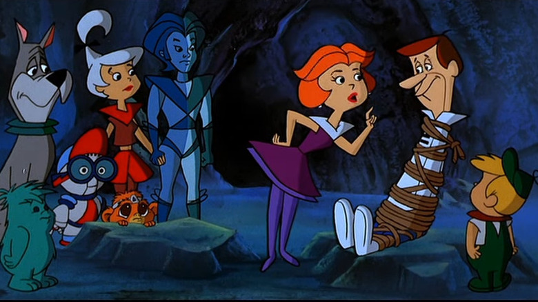 George Jetson yang terikat dimarahi oleh keluarganya di Jetsons: The Movie
