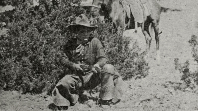 Cow sponsors with a rifle in the 1920 movie