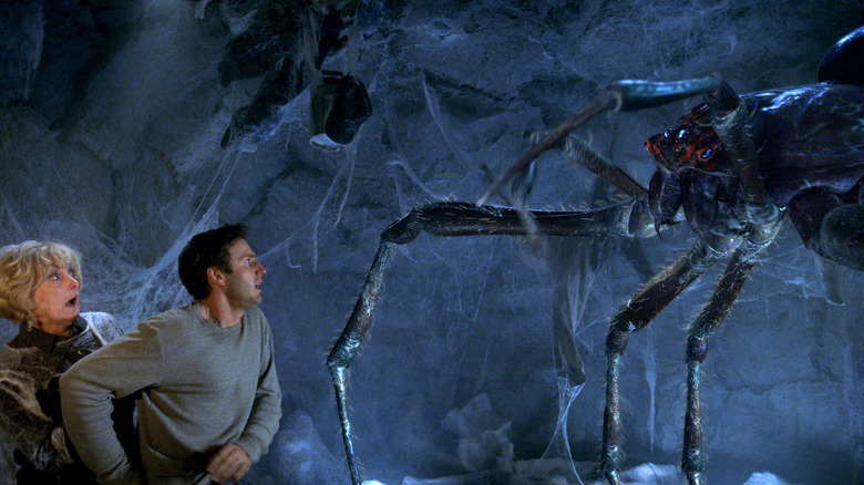 Gladys and Christopher facing down the giant spider at the end of Eight Legged Freaks