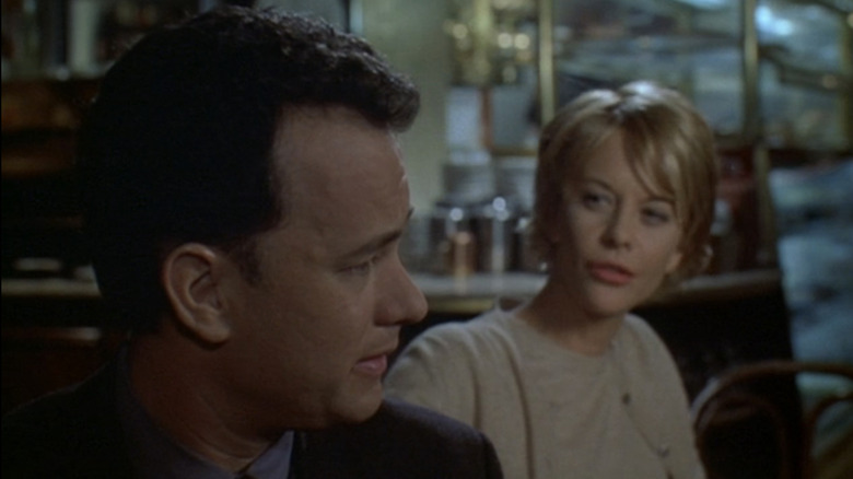 Tom Hanks' Joe Fox turns to look at Meg Ryan's Kathleen Kelly in You've Got Mail